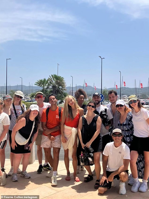 She also posted a cheerful shot of a camera crew gathered together at the marina