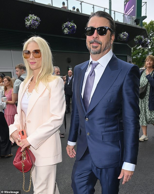 David opted for a smart navy suit and lilac tie, while Jordyn opted for a cream two-piece
