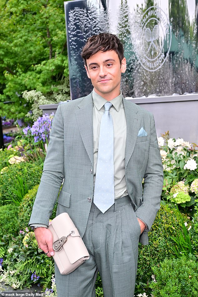 He added a designer touch with a Christian Louboutin clutch bag
