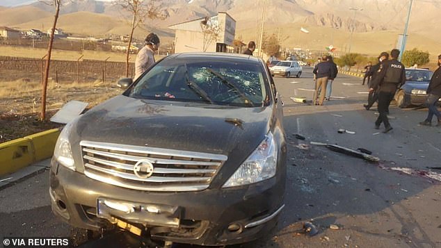 The attack that killed Mohsen Fakhrizadeh, pictured is his Nissan with the window shot at and his blood on the road