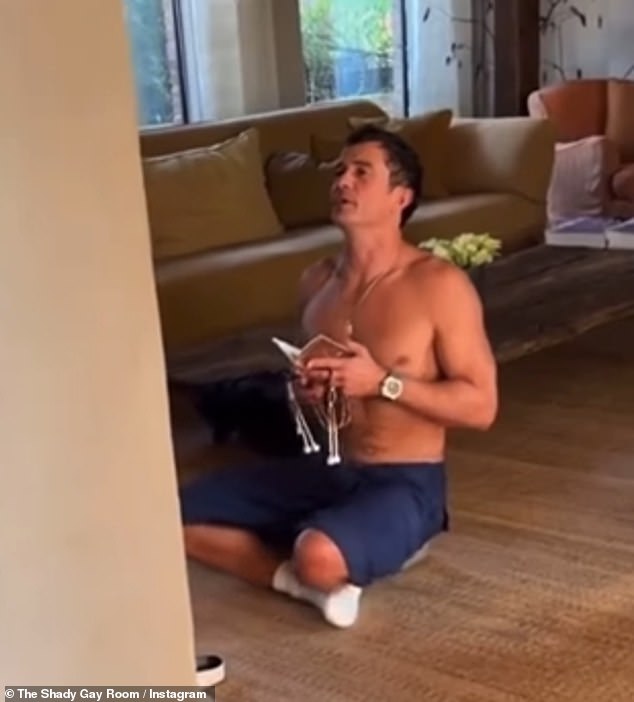 In the resurfaced clip, Orlando, who has been a practicing Buddhist since he was 16, sits cross-legged and shirtless on the living room floor while praying