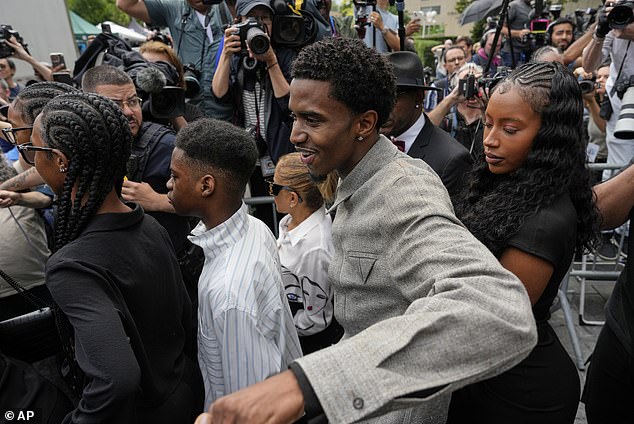 Diddy's sons Christian and Justin Combs (pictured outside the are eager for their father to 'come home' after the jury delivered their shocking verdict in his sex trafficking and racketeering trial