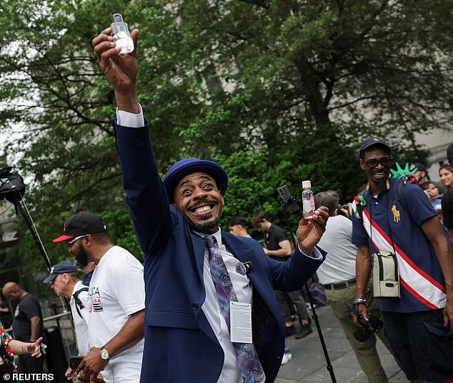 Sean 'Diddy'  Combs' die-hard fans were seen rejoicing outside the courthouse and heard chanting 'let Puffy go' as one man (pictured) was seen waving around small bottles of baby oil