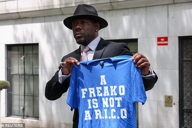 Several other supporters held up and donned 'A FREAKO IS NOT A R.I.C.O.' shirts outside the courthouse
