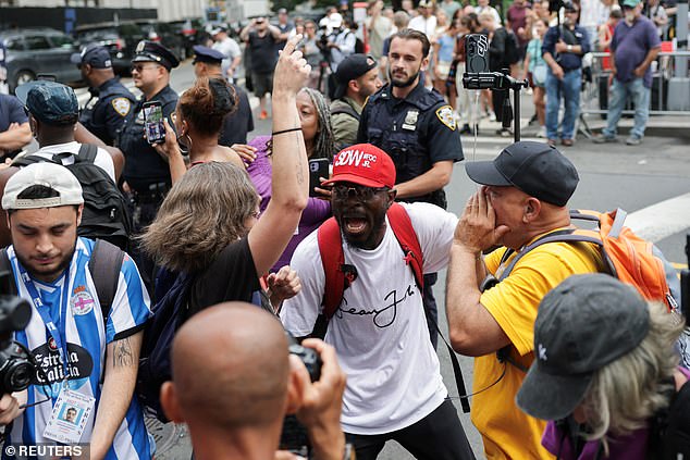 A slew of people are seen cheering after news of Diddy's verdict was announced