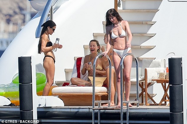 Also on board was Kate’s stylist Sophie Lopez, who brought more bikini heat to the scene with her own bombshell look