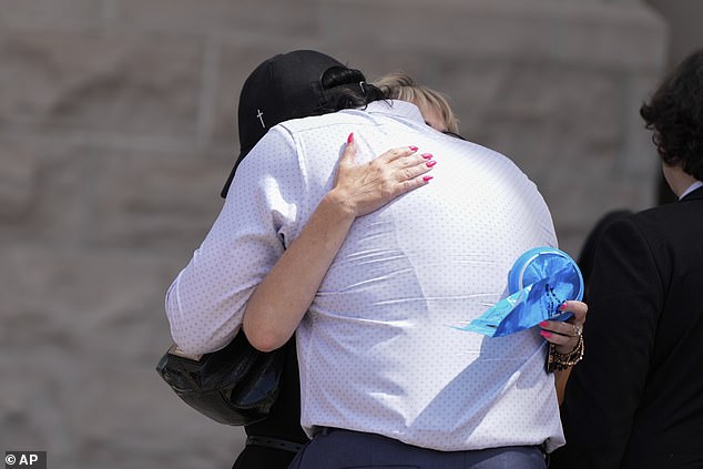 Steve Goncalves, the father of Kaylee Goncalves, hugs mother Kristi Goncalves after Bryan Kohberger's plea deal hearing