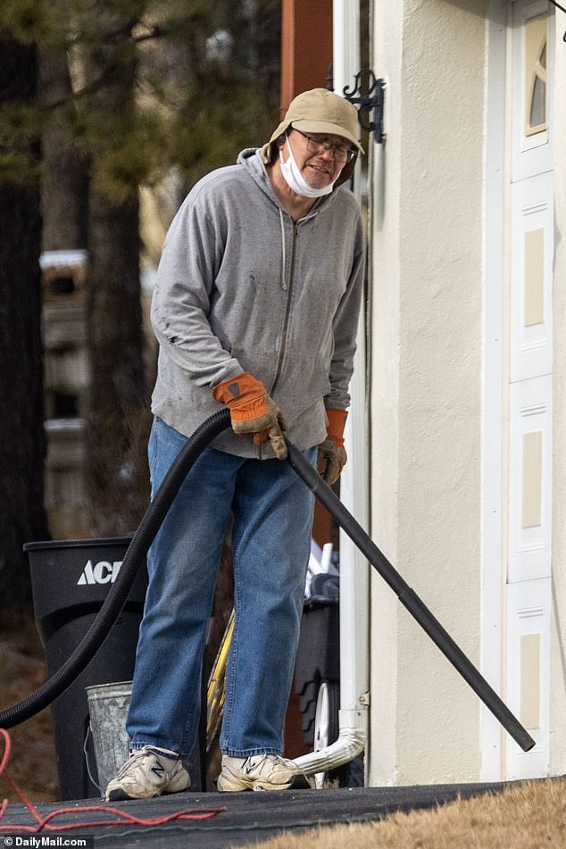 Michael Kohberger, father of accused killer Bryan Kohberger, is seen cleaning up the property around the Albrightsville, Pennsylvania in July 2023