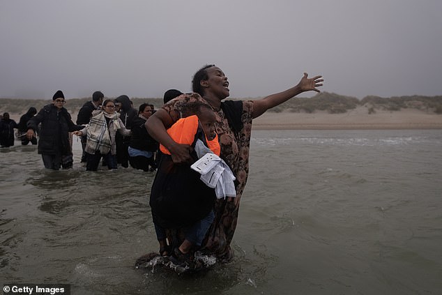 One hysterical woman, clutching her screaming toddler wrapped in a life vest to her breast, made a break for the already overloaded dinghy