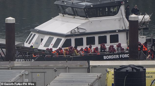 A group of people thought to be migrants are brought in to Dover, Kent, from a Border Force vessel following a small boat incident in the Channel