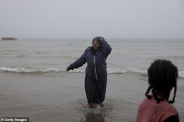 Overcome with devastation, the woman cries on the French shores after missing the opportunity to sail to the UK