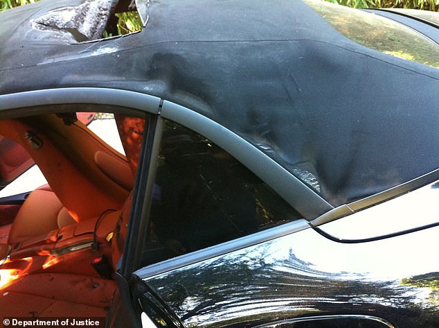 The car's soft top appeared to have a gaping hole in the middle