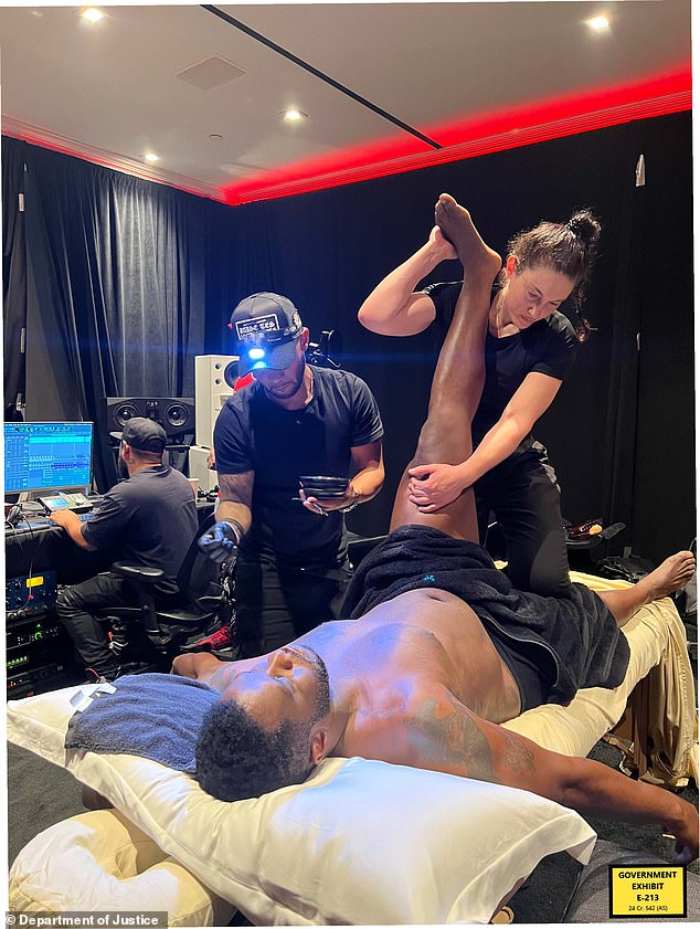 The disgraced music mogul was seen with his leg in the air as a female masseuse held it up while she sat on the table