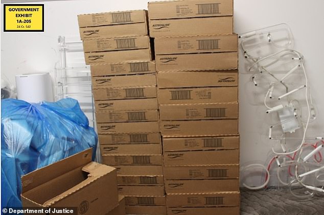 A mountain of baby oil is seen in boxes