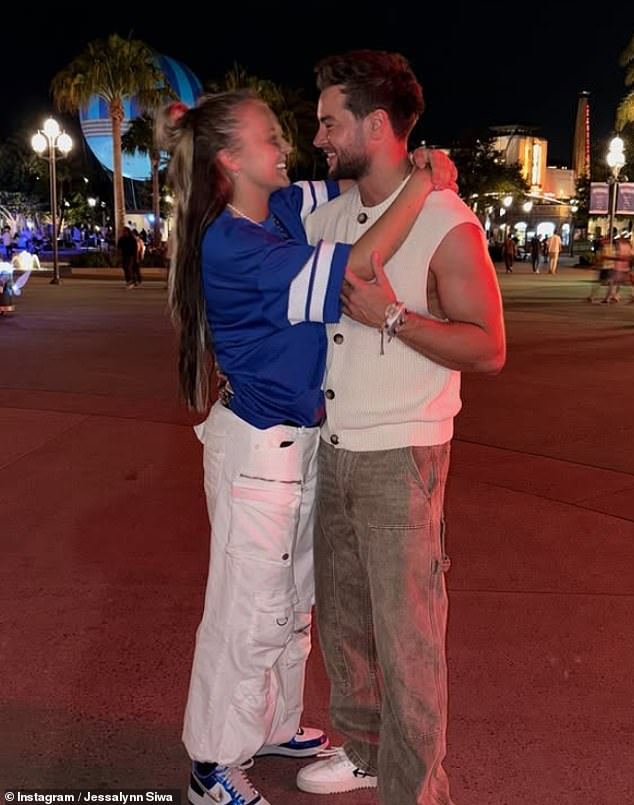 Elswhere JoJo's romance with Chris appears to be heating up , as fans have begun to speculate whether she's plotting a permanent move to the UK (pictured with Chris in May)