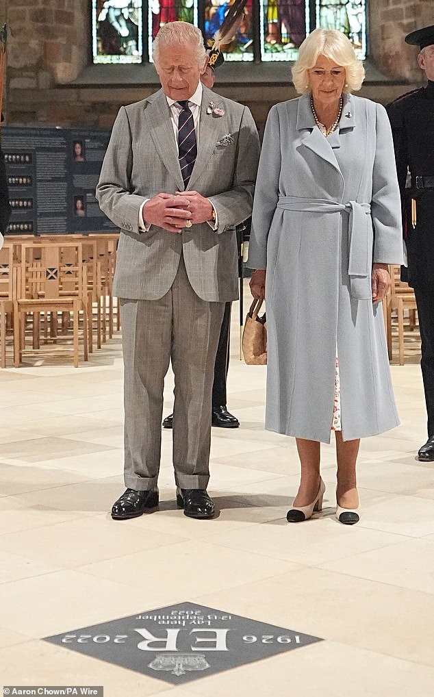 King Charles III and Queen Camilla unveil a memorial stone in St Giles Cathedral in Edinburgh