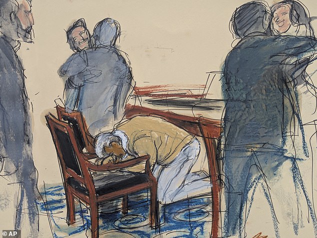 Diddy (center) reacts after hearing his verdict in court on July 2. His attorneys are seen embracing and smiling, while he sits his head in his hands (court sketch)