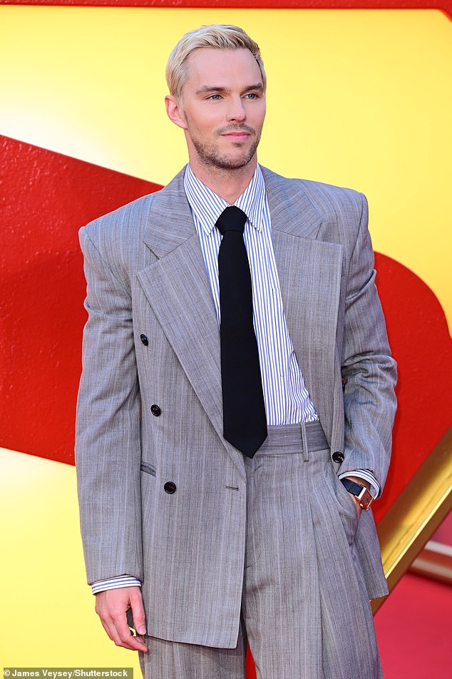 He wore a dapper grey suit and tie