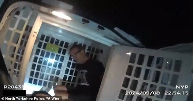 When asked about the repeated use of a knife causing six significant stab wounds to her back, Carr suggested he had 'blacked out' (Pictured: Carr in a police van following the attack)