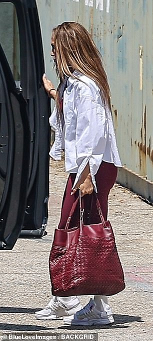 She was dressed in a more muted ensemble for her dance rehearsal than usual with a pair of burgundy leggings