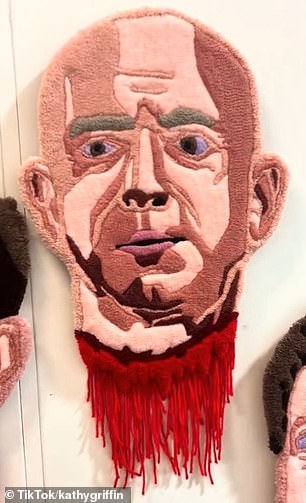 The four decapitated heads depicted are Elon Musk, Jeff Bezos, Mark Zuckerberg, and the current president, with the video panning across them hanging on the wall