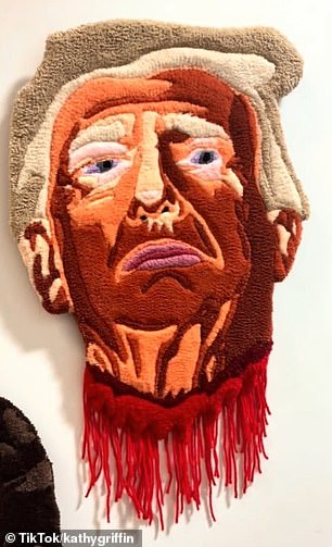 The four decapitated heads depicted are Elon Musk, Jeff Bezos, Mark Zuckerberg, and the current president, with the video panning across them hanging on the wall