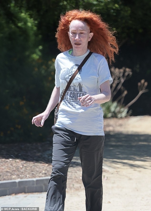 Griffin was noticeably makeup-free and her flaming red hair looked wild as it blew around in the breeze