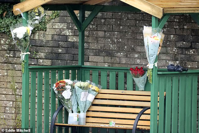 Flowers were left in Russell Way, Crawley, following the death of Mr Hendricks. Friends described him as 'the nicest guy you'd ever meet'