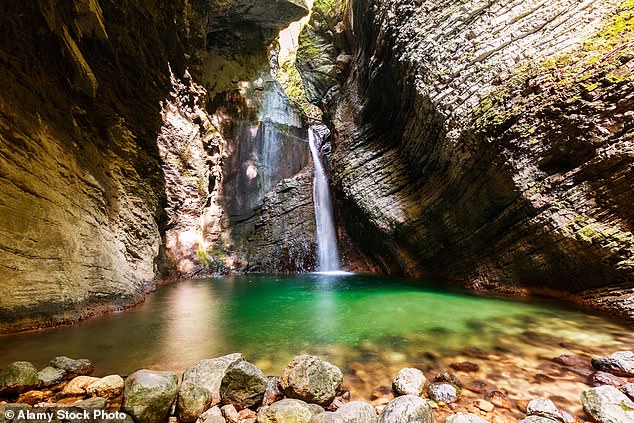 A third wrote: 'My answer was Slovenia too. It's been more than two weeks since we are back. Cant get those green pasture scenery out of my mind - we were in Kranjska Gora.' (Pictured: Kozjak Waterfall, Slovenia)