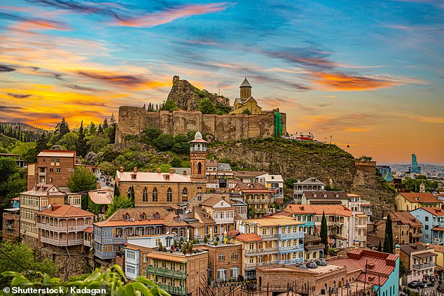 Georgia, situated at the crossroads of Europe and Asia, captivated adventurers with 'the most mystical, fairy book mountains they¿ve ever seen' (Pictured: Historical streets of Tbilisi)