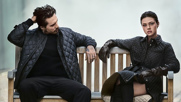 The pair posed in his 'n' hers matching quilted jackets - one black and another cream a which sell for more than £1000
