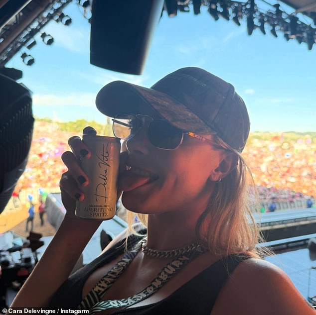 The couple were seen smooching as they posed for a selfie showing off their inkings while side stage at Alanis's gig
