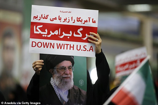 Pictured: People attend a memorial ceremony for scientists, civilians, and senior officials killed in Israeli attacks in Tehran where participants carried anti-U.S. placards, and photos of Ayatollah Ruhollah Khomeini and Iranian Supreme Leader Ali Khamenei