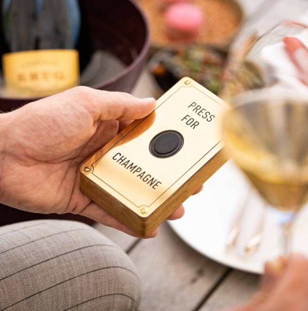 Push the button: Guests checking in at the Dolder Grand's Krug Lounger X champagne bar can access flutes without leaving their table