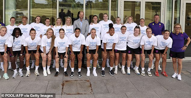 Swiss-bound: Prince William pictured with the Lionesses ahead of their flight to Switzerland at their UK training ground