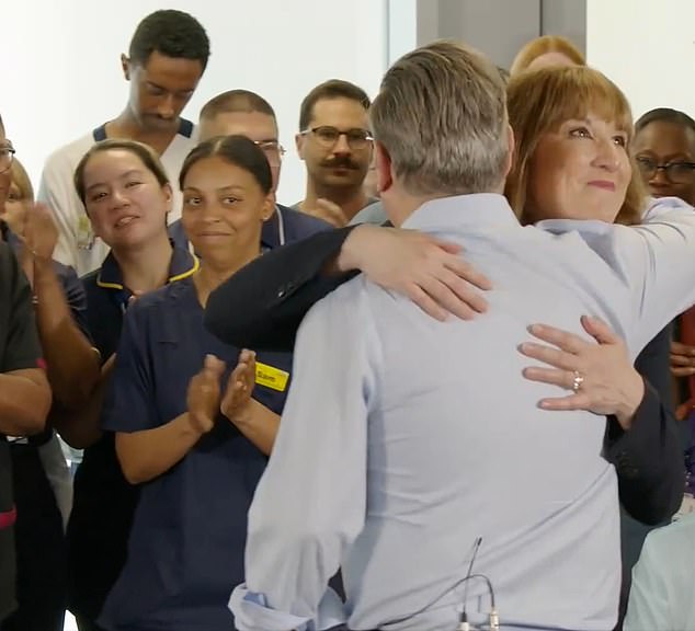 Chancellor Rachel Reeves was flanked at the NHS event in London by Keir Starmer - who gave her an awkward hug. But onlookers seemed to be regarding her upbeat demeanour with some scepticism