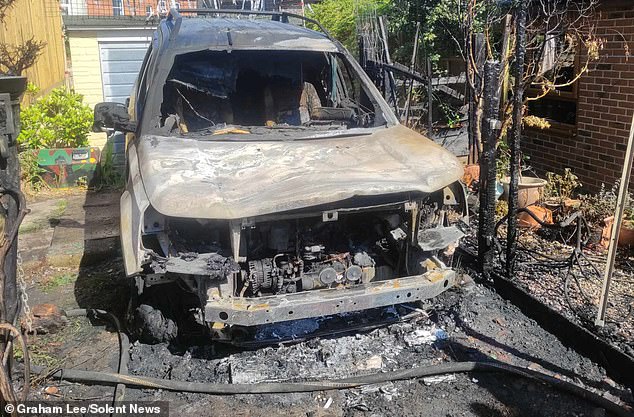 Mr Lee's wrecked Land Rover. The wildlife volunteer, from the Isle of Wight, tried to extinguish the blaze with a hosepipe before firefighters arrived