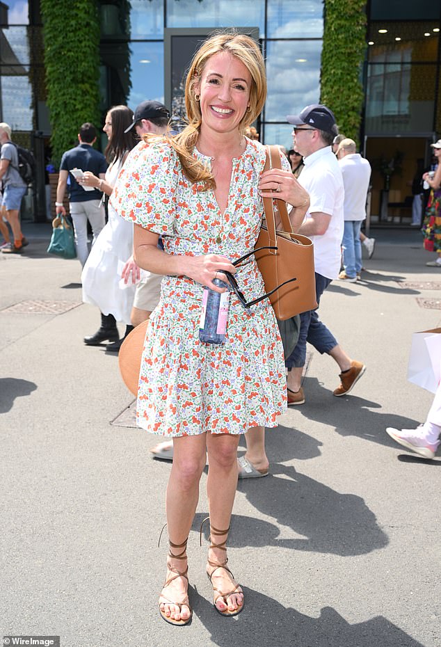 Cat dressed for the Centre Court sunshine in a pretty floral print dress teamed with lace-up sandals