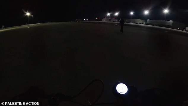 Footage shows two protesters riding electric scooters across the runway at RAF Brize Norton