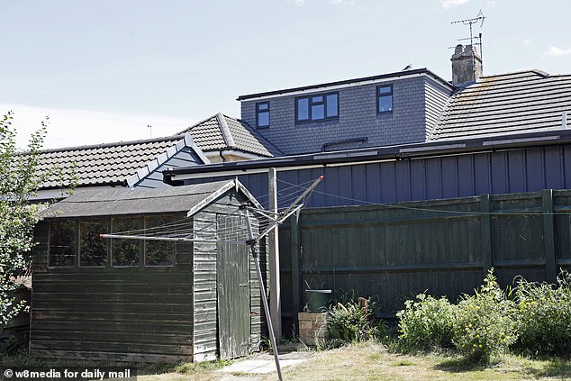 The view of the extension from one of the neighbour's gardens on a nearby road