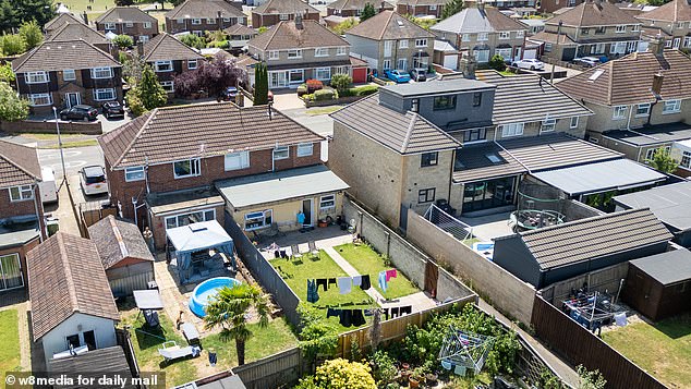 An aerial view shows the property in relation to the others on the street