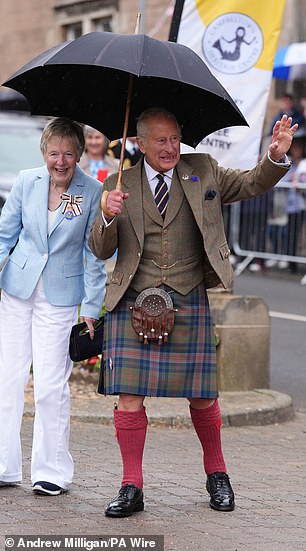 Wearing a traditional kilt with a matching tie and smart suit jacket, Charles, 76, looked relaxed as he attended a community reception with invited guests and representatives from local charities