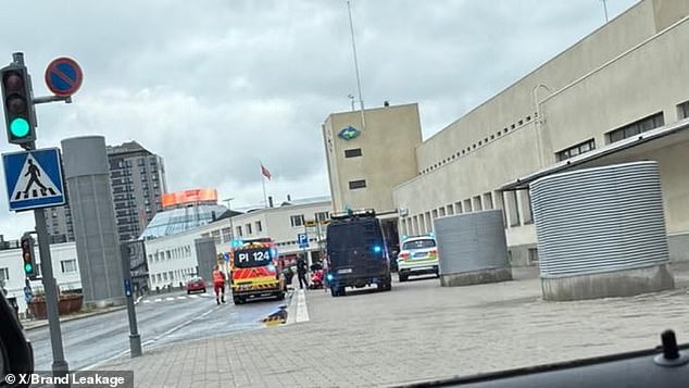 Police and ambulances are seen outside Ratina on Thursday, July 3. One person has been arrested