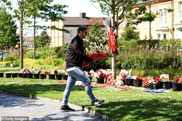 Liverpool fans laid flowers and shirts at Anfield today to honour the late forward