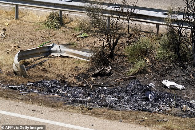Debris and burn marks are seen along the A-52 motorway at the crash site where Liverpool sriker Diogo Jota and his brother Andre Felipe died