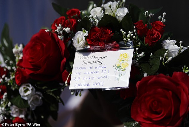 Several Liverpool fans gathered at Anfield on Thursday morning to lay flowers and messages in honour of Jota, as the world of football fell into mourning