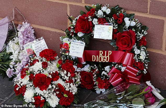 'RIP Diogo': Supporters pay their respects by laying bouquets of flowers outside the stadium