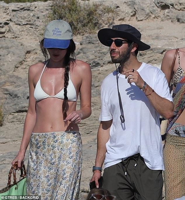 The 35-year-old Materialists actress shrugged off her recent Chris Martin breakup alongside a mystery male companion