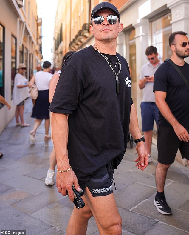 Orlando is pictured this past Saturday in Venice, where he traveled alone to attend Jeff Bezos and Lauren Sanchez's wedding, despite Katy being friends with the bride