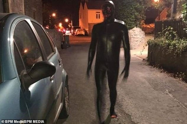 The episode has drawn comparisons with the 'Somerset Gimp' (pictured) who terrified motorists driving home at night by dressing in a black gimp suit in May 2023 near Weston-super-Mare